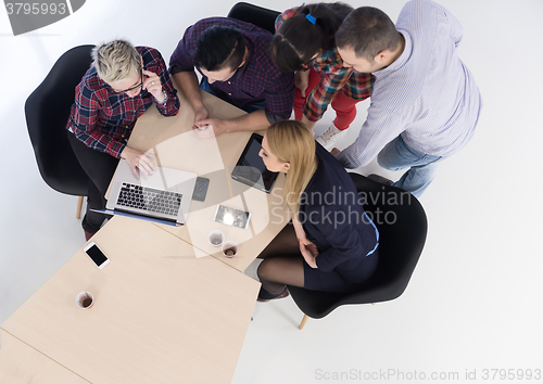 Image of aerial view of business people group on meeting