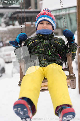 Image of little boy having fun on winter day