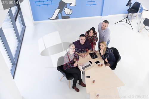 Image of aerial view of business people group on meeting