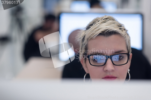 Image of startup business, woman  working on desktop computer