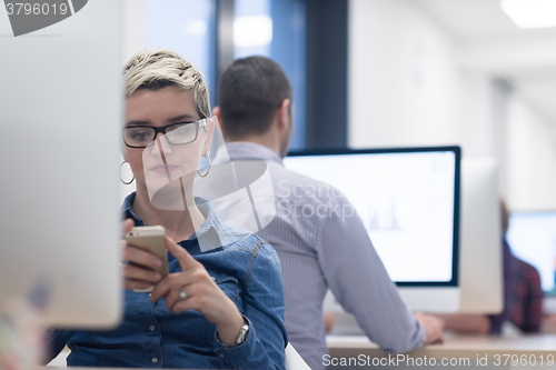 Image of startup business, woman  working on desktop computer