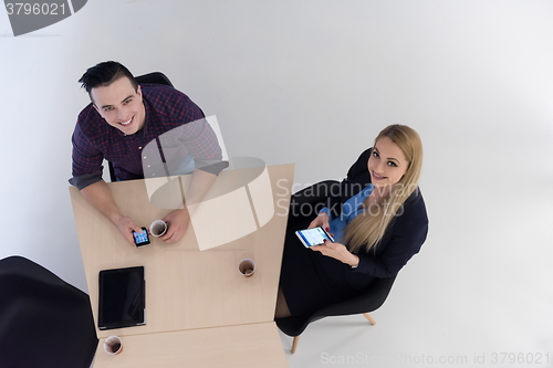 Image of aerial view of business people group on meeting