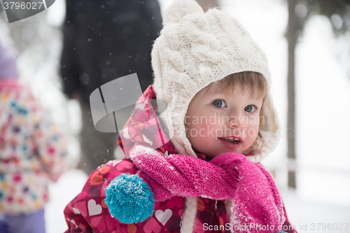 Image of little girl at snowy winter day