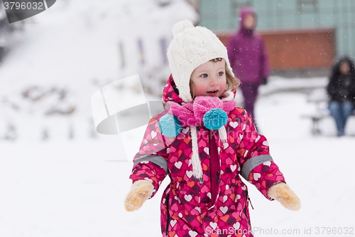 Image of little girl at snowy winter day