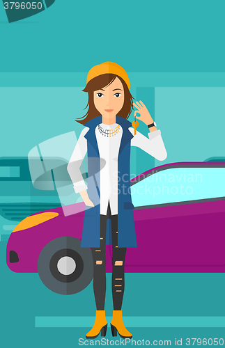 Image of Woman holding keys from new car.