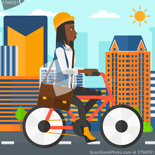 Image of Woman cycling to work.