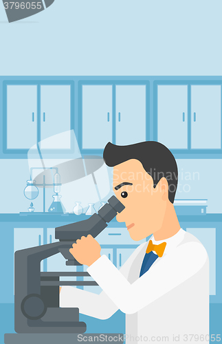 Image of Laboratory assistant with microscope.