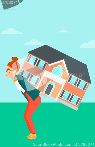 Image of Woman carrying house.