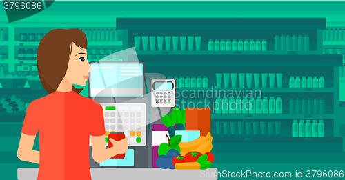 Image of Cashier at supermarket checkout.