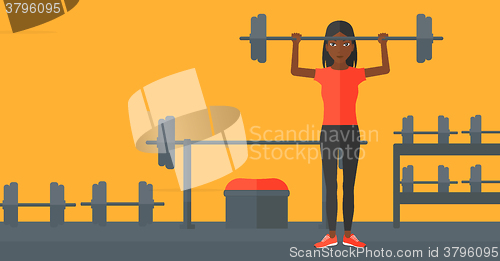 Image of Woman lifting barbell.