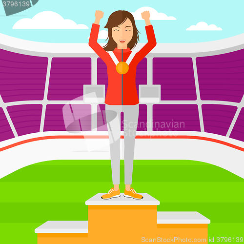 Image of Athlete with medal and hands raised.