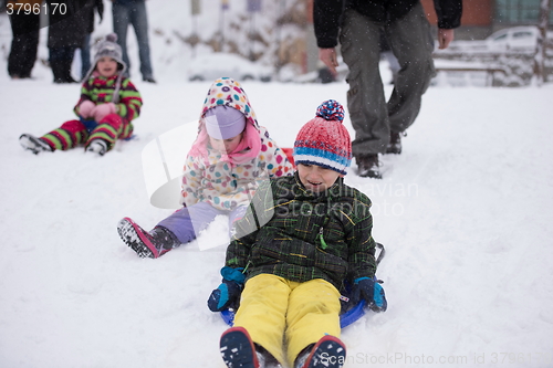 Image of group of kids having fun and play together in fresh snow