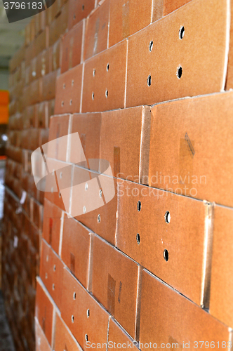 Image of Cardboard packing boxes in a warehouse, background