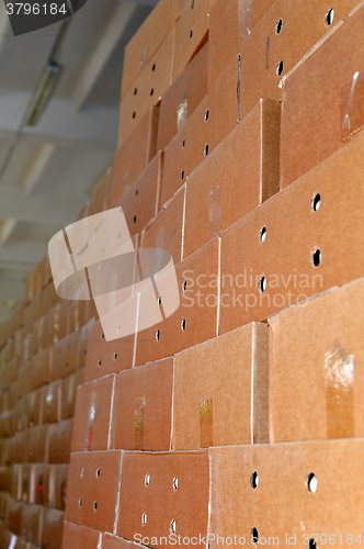 Image of Cardboard packing boxes in a warehouse, background