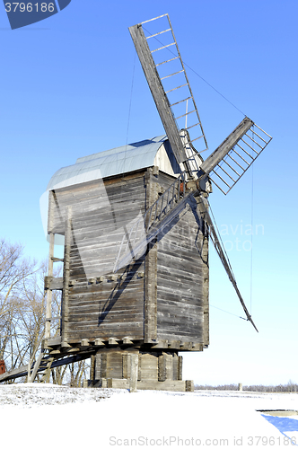 Image of Old wooden windmill close up in winter