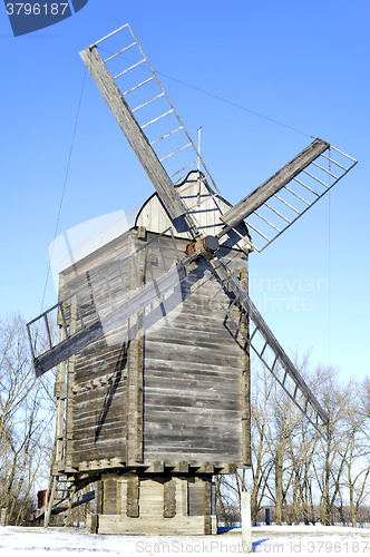 Image of Old wooden windmill close up in winter