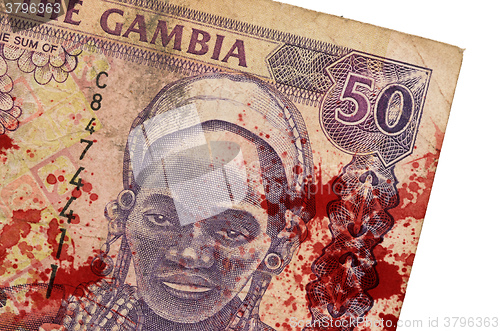 Image of 50 Gambian dalasi bank note, bloody