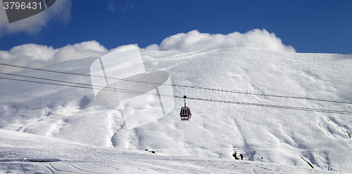 Image of Panoramic view on gondola lift and ski slope at sun day