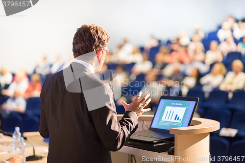 Image of Speaker at Business Conference and Presentation.