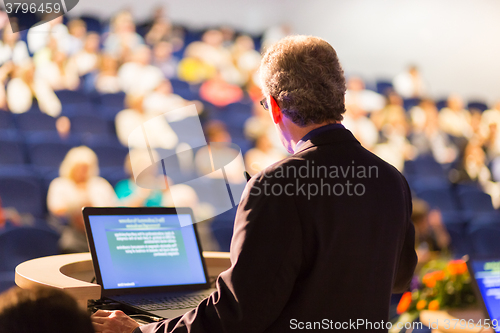 Image of Speaker at Business Conference and Presentation.