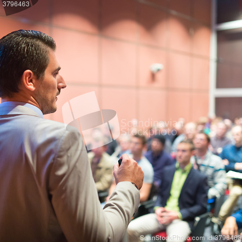 Image of Speaker at Business Conference and Presentation.