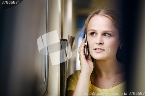 Image of Woman talking on the phone