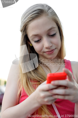 Image of Young girl sending a message