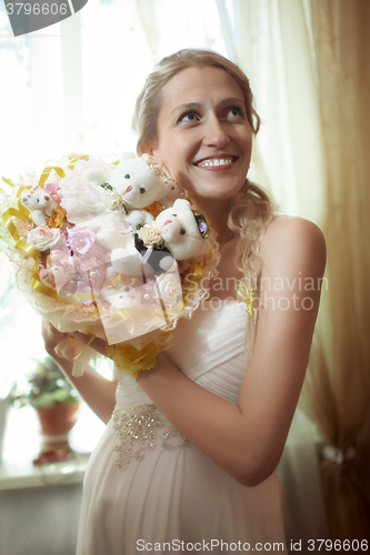 Image of Beautiful young bride with a wedding bouquet