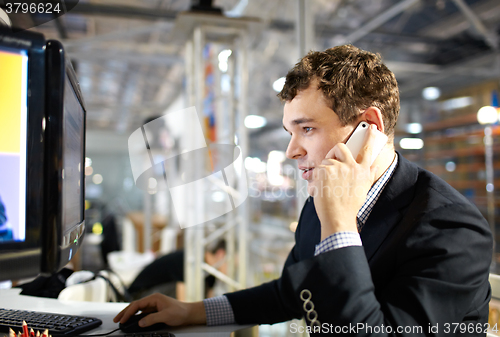 Image of Working and talking on the phone.