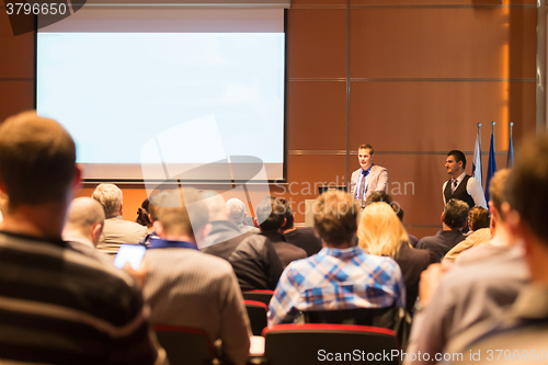 Image of Speaker at Business Conference and Presentation.