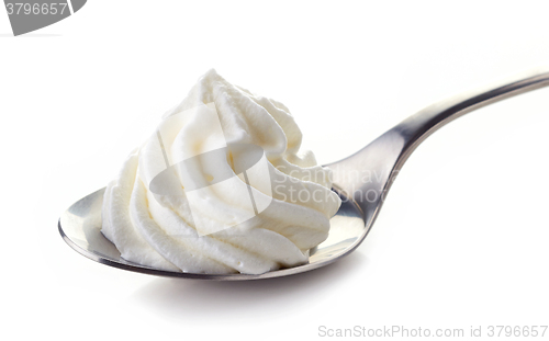 Image of spoon of whipped cream