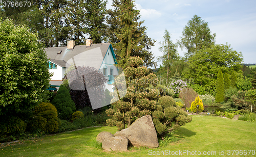 Image of Beautiful house in spring garden