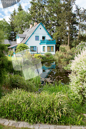 Image of Beautiful house in spring garden