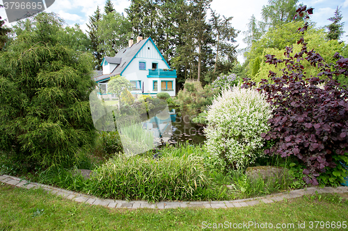 Image of Beautiful house in spring garden