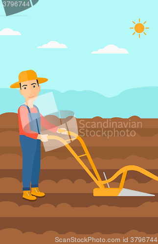 Image of Farmer on the field with plough.