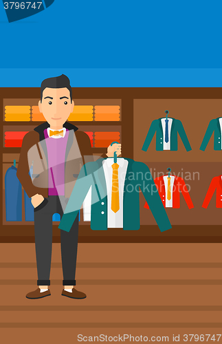 Image of Man holding jacket.