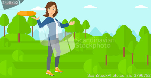 Image of Woman playing frisbee.