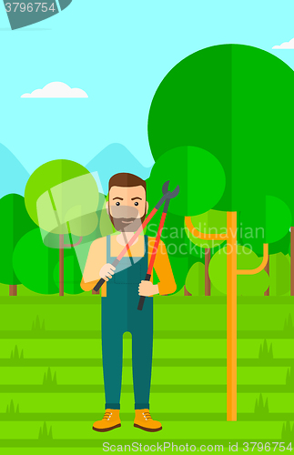 Image of Farmer with pruner in garden.