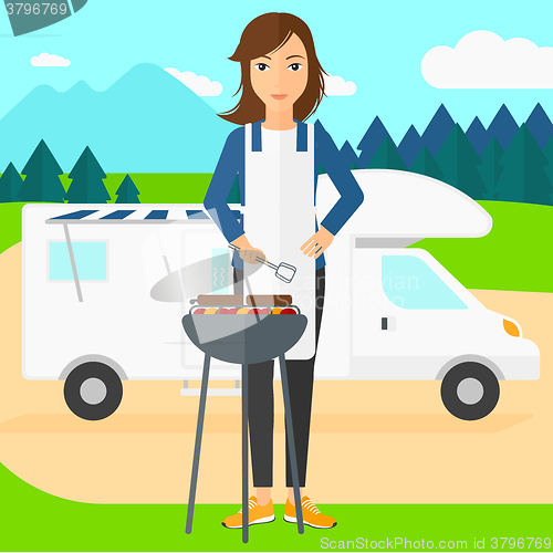 Image of Woman preparing barbecue.