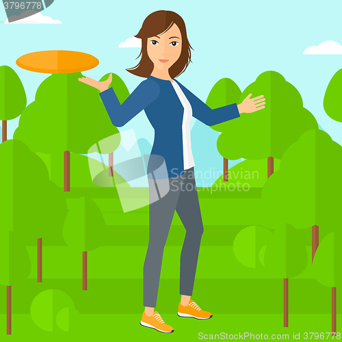 Image of Woman playing frisbee.