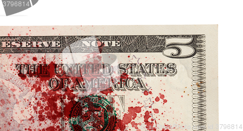 Image of US five Dollar bill, close up, blood