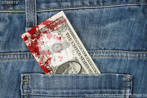 Image of Macro shot of trendy jeans with american 1 dollar bill, blood