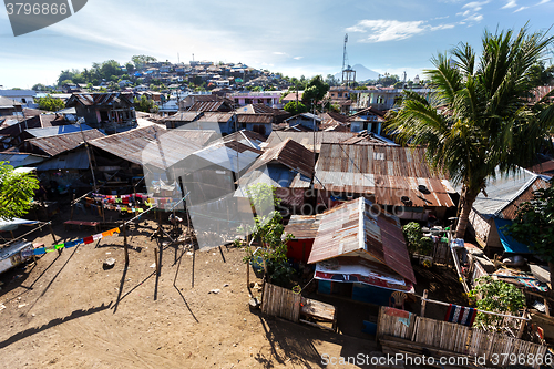 Image of poor houses by the river in shantytown