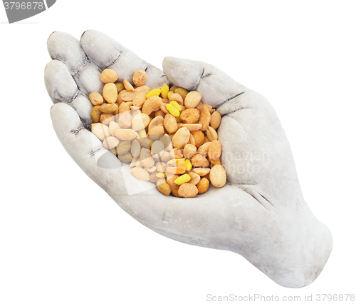 Image of Fresh mixed salted nuts in a bowl (hand), peanut mix