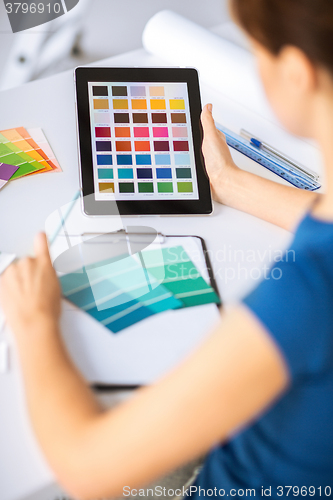 Image of woman working with color samples for selection