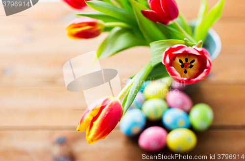 Image of close up of easter eggs and flowers in bucket