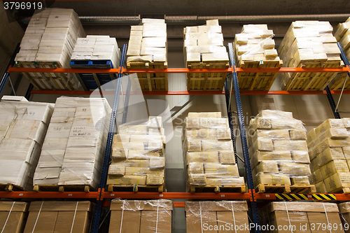 Image of cargo boxes storing at warehouse shelves