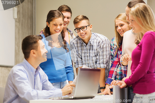 Image of group of students and teacher with laptop