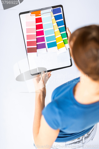 Image of woman working with color samples for selection