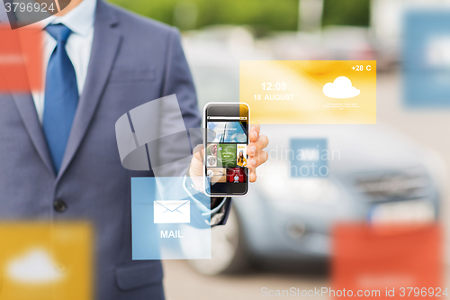 Image of close up of business man with smartphone media